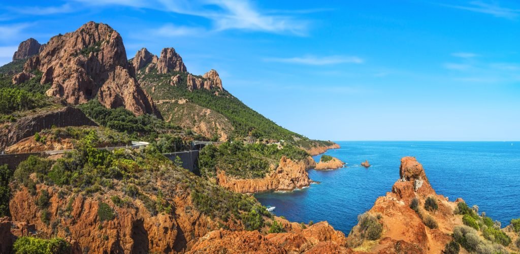 Esterel rocky beach coast and sea. Saint Raphael, Cannes, Cote A Esterel mediterranean red rocks coast, beach and sea. French Riviera in Cote d Azur near Cannes Saint Raphael, Provence, France, Europe.
